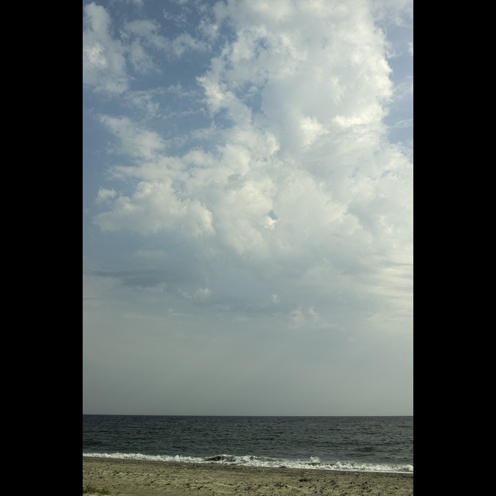 A day on the beach contemplating the clouds