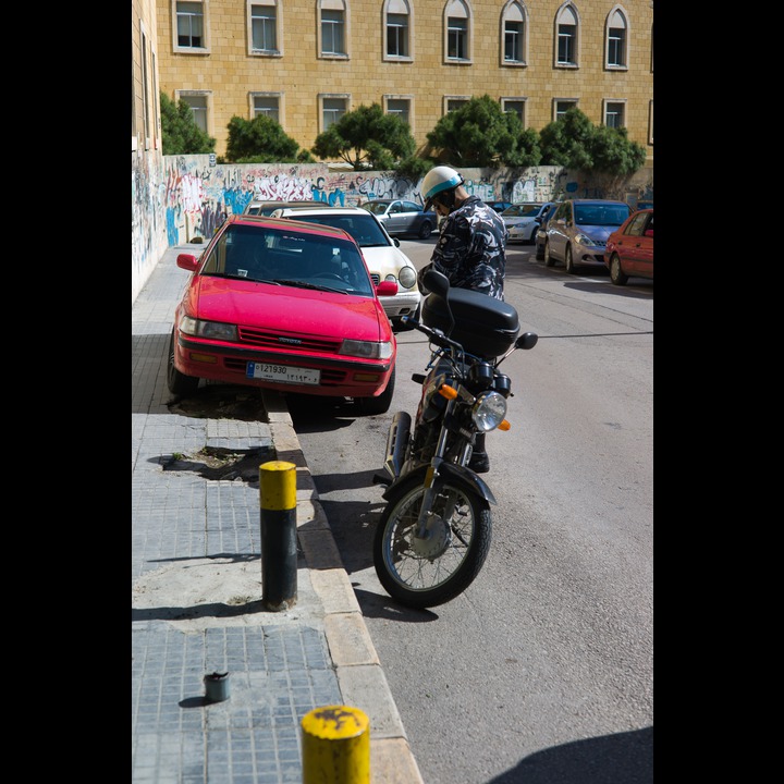 Parking attendant issuing a  ticket on Rue Kennedy!