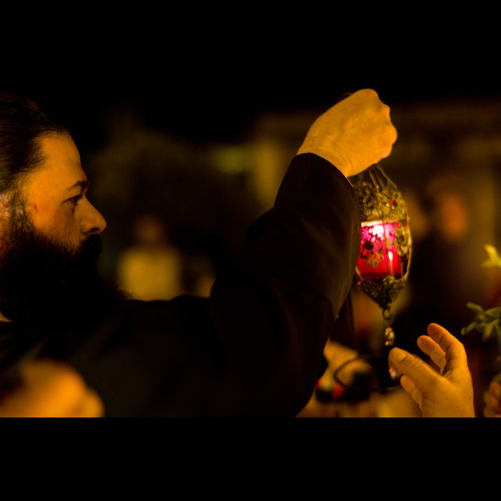 The Greek Orthodox pastor of Marjaayoun with his relit copy of the flame