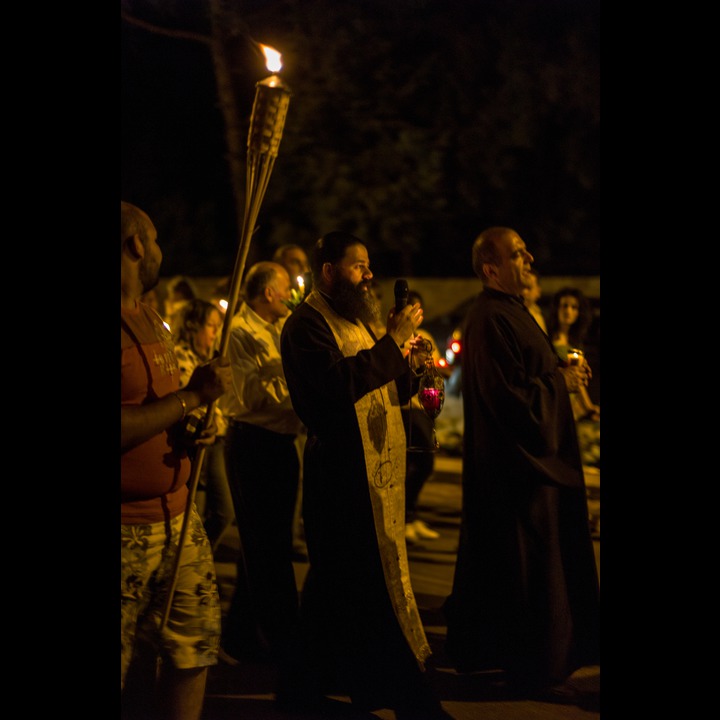 The procession taking the Holy Flame from the Boulevarde to the Greek Orthodox Church in Marjaayoun