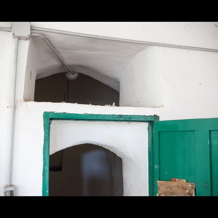 Votive candle above the entrance door to the Khodr shrine in Hebbariyeh