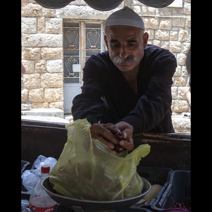 Druze fruitseller at Deir Mimas