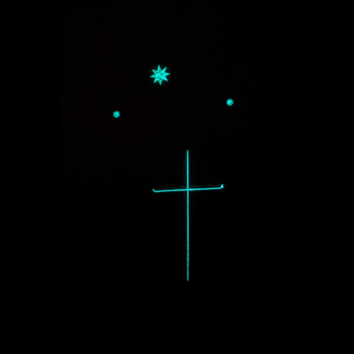 The cross that glows in the dark by my bedside table