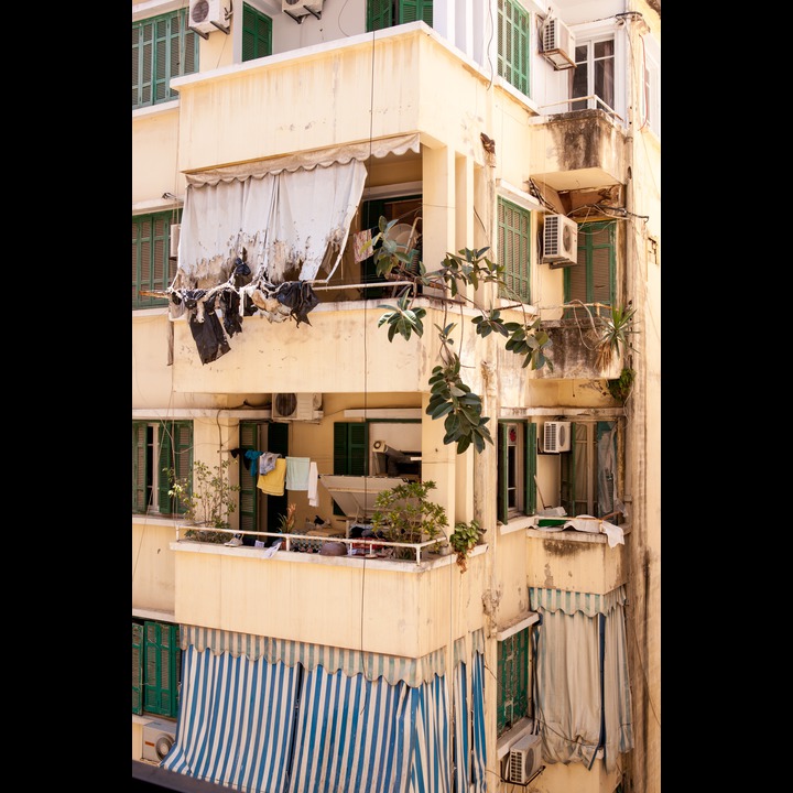 Study this view of the neighbors' balconies in our back yard.