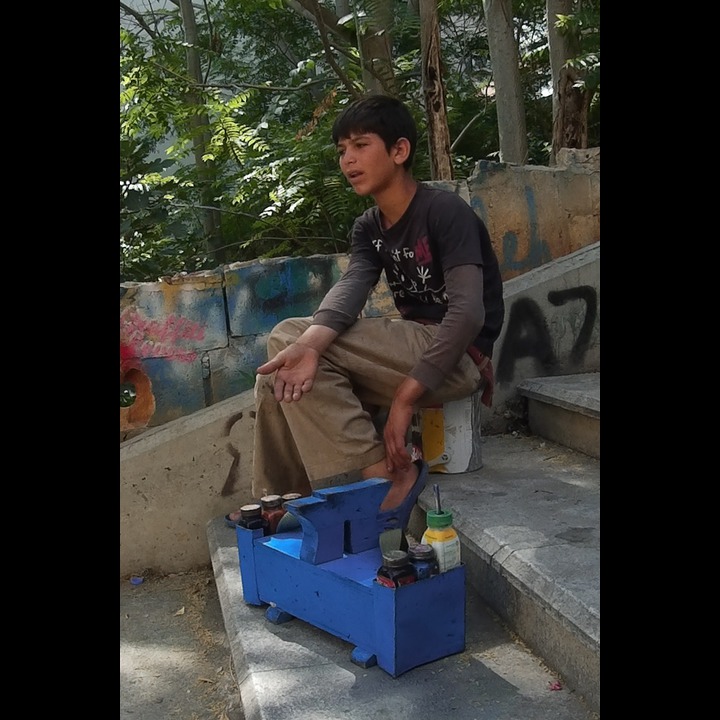 Syrian refugee shoe shine boy on the AUB stairs in AIn el Mraisseh