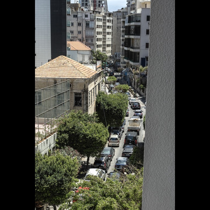 Every single one of these cars were sounding their horns because the green Sukleen garbage truck at the end of the street was doing its job