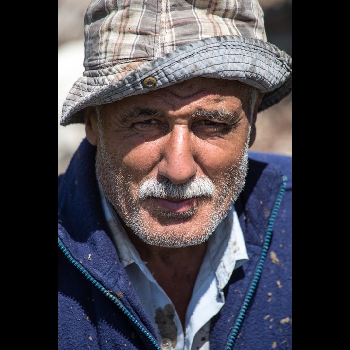 A workman in the Zaatari orchards at the Litani River